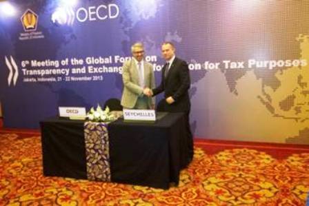 Minister Adam (right) after signing the letter of intent