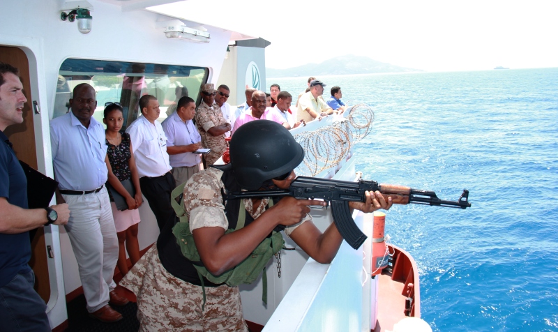 Guests watch as the exercise to foil the 'pirate attack' unfolds Phot: Seychelles Nation