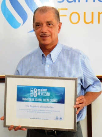 Former President Michel holding his award