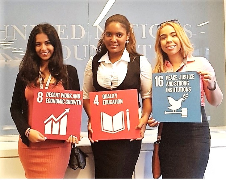 UN youth board member with SDG signs at the UN USA Association Picture at the events