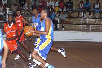 Bertin, with ball, had the hot hands for Cobras with 25 points including seven treys