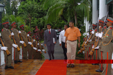 H.E. Ajay Bramdeo (left) is greeted by a 14-man Guard of Honour on his way to presenting his credentials to President Michel