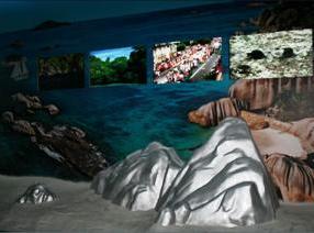 Rocks in stainless steel and make-believe granite in which screens have been fixed to broadcast images and videos of Seychelles habitat, flora and fauna