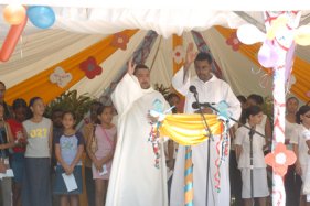Father Gappy (left) and Rev. Elizabeth giving their blessing to the Child Protection Week activities