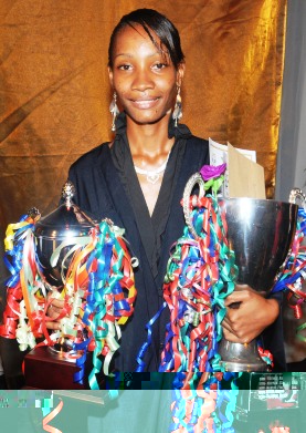 A proud Valerie with her trophies on graduation day