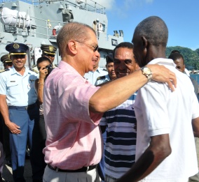President Michel receiving some of the rescued fishermen