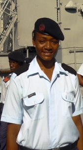 A relaxed and smiling Private Sanguignon in front of the Andromache, after the operation to intercept, disarm and arrest the suspected pirates, rescue the fishermen and bring them home