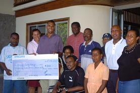 Cheque presentaion to Danny Beauchamp-SBF reaches out to former Indian Ocean long jump king Beauchamp