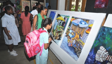 Guests and students viewing the displays in the exhibition