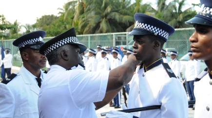 Police Commissioner Ernest Quatre promoting the young police leaders to the rank of Sergeant