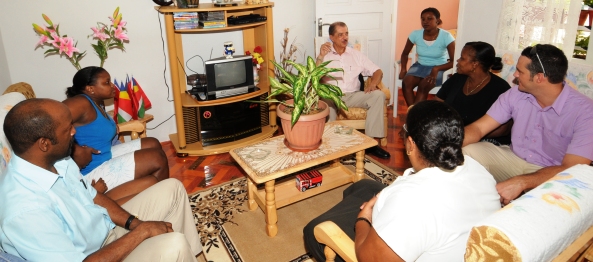 The delegation visiting one of the families who have recently moved into their new home