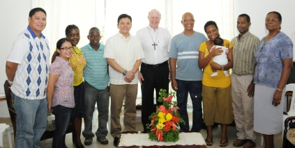 Father Joel and his delegation in a souvenir photograph with Bishop Wiehe and other couples of the movement"Couples for Christ"