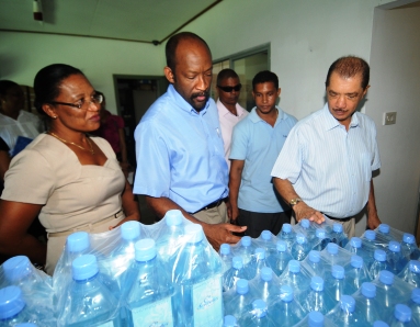 Inspecting the bottled water products of a small enterprise at Port Glaud