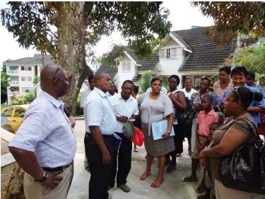 HFC and MLUH officials brief residents on their new apartments in the presence of MNA Fideria (left)