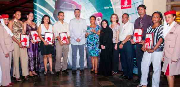 The Emirates team pose with representatives of the top travel agents for 2011-2012