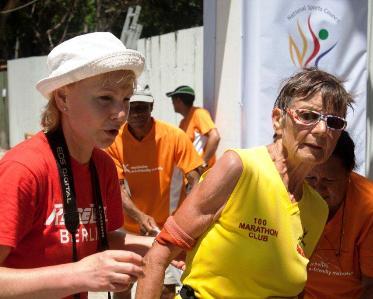 German Sigrid Eichner (centre) after completing her 1,751st marathon