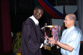 Ahmadou Sylla receives the President's Cup from President Michel