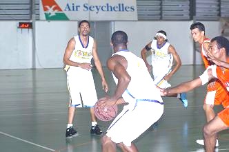 Premium Cobras’ ‘Dulla’ (1st left), Bertin and Kolawole (with ball) work the ball to break down the PLS Hawks defence