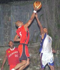 Rocker Cyril Agrippine (left) is challenged by Razor Nigel Cafrine as he drives to the hoop