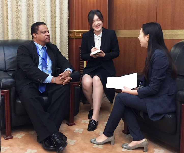 Mr Gabriel being interviewed by the China Television. The interviewer, who had just been to Seychelles on her honeymoon, is pictured on the right face to face with Mr Gabriel