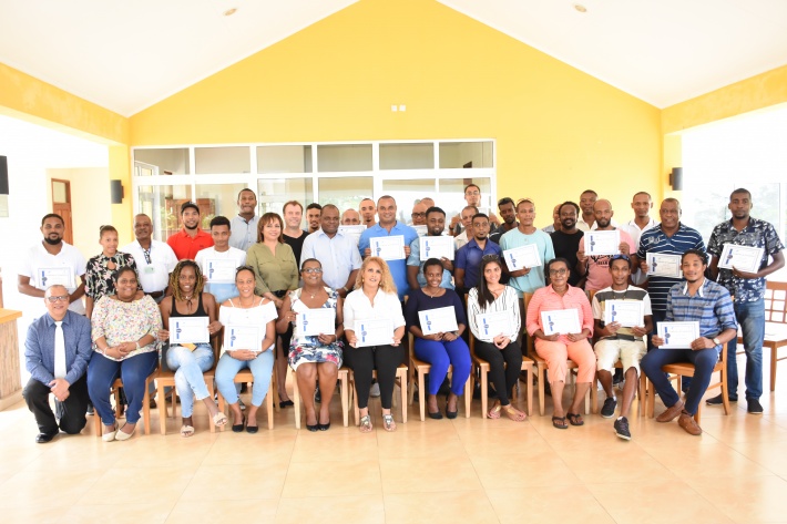 Tour guides receive certificates after successfully completing training