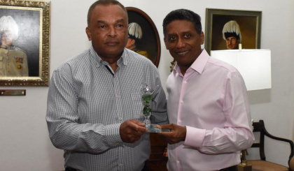 President Faure congratulates Wills Agricole for his green champion award
