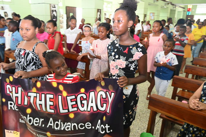 Candlelight memorial mass honours lives lost to HIV/Aids