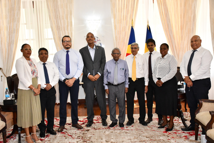 Law Commission presents commemorative Constitution to President