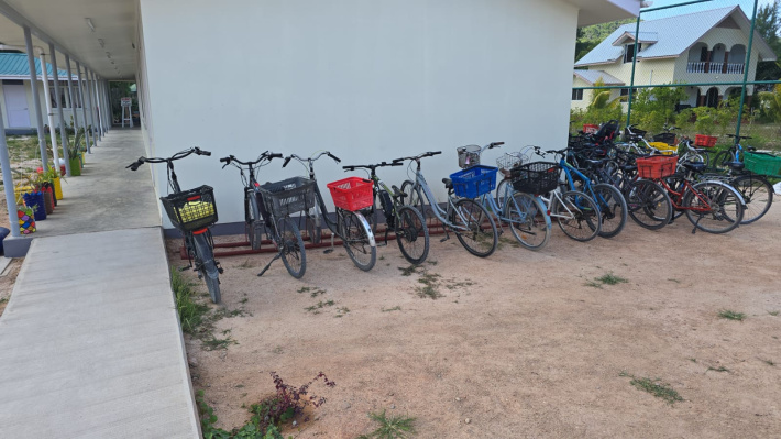 A bicycle, a school bag and a daily island adventure!